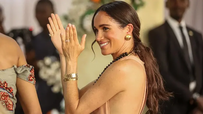 Meghan Markle Sparks Controversy During Nigeria Trip By Wearing Dress Called 'Windsor' - SurgeZirc